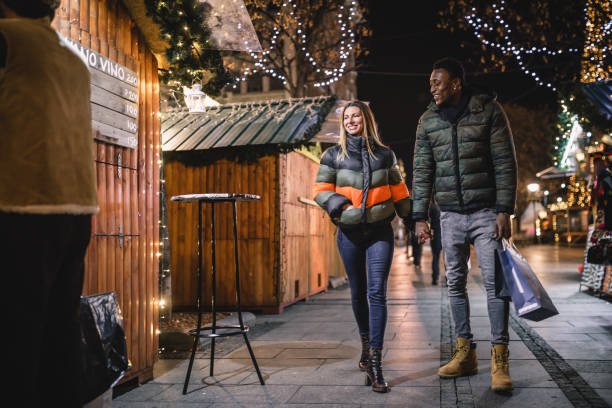 istock Diverse couple Christmas shopping 1185399573