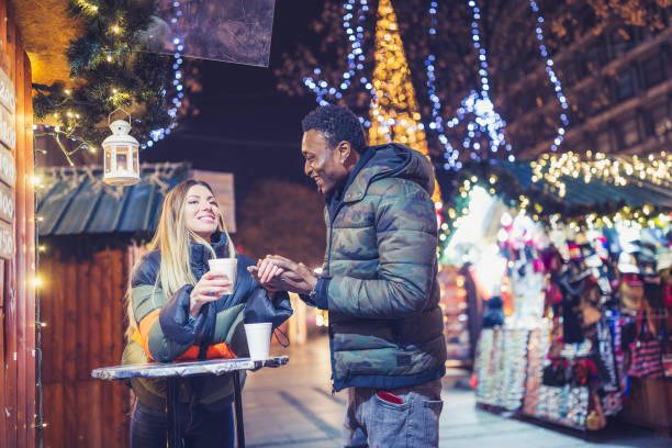 istock Diverse couple Christmas shopping 1185399625