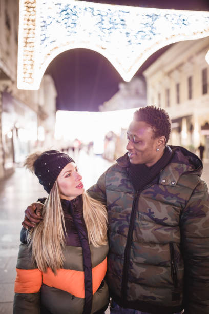 istock Diverse couple Christmas shopping 1185399675