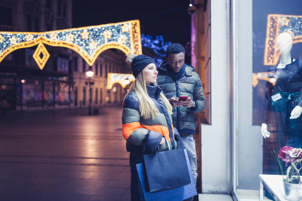 istock Diverse couple Christmas shopping 1185399690