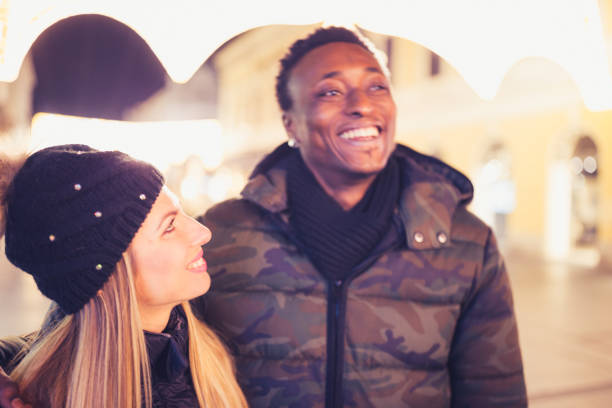 istock Diverse couple Christmas shopping 1185399739