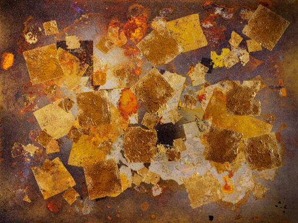 istock Abstract, gold leaf background on a rusty metal surface. 1185401153