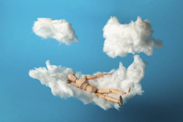 istock Toy man relax on cloud bed. Business freedom, keep calm 1185402487