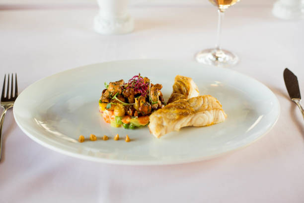 istock baked fish and baked vegetables in a restaurant 1185403901