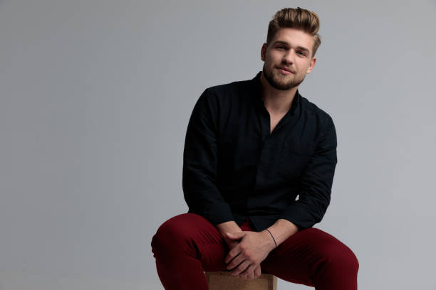 istock Confident fashion man looking forward and holding his hands together 1185403999