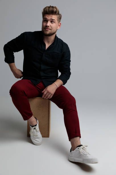 istock Modern fashion man looking away and thinking 1185404077