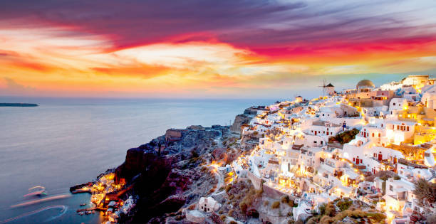istock panorama of amazing sunset over Oia, Santorini 1185404123