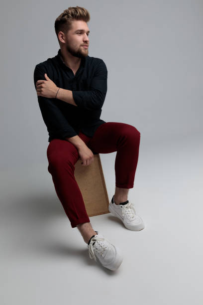 istock Pensive fashion man confidently looking away 1185404533
