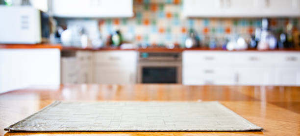 blurred kitchen interior with napkin on table stock photo