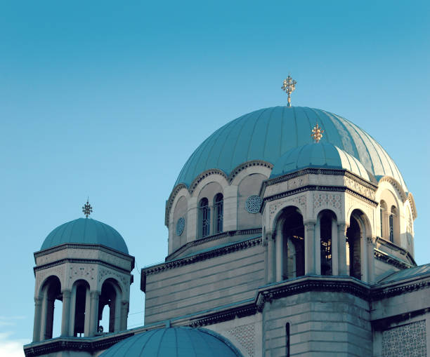 Orthodox temple of Holy Trinity and St Spiridone by the Canal Grande, the northern Italian city of Trieste. Beautiful blue clear sky in the background and sun beams through the church.