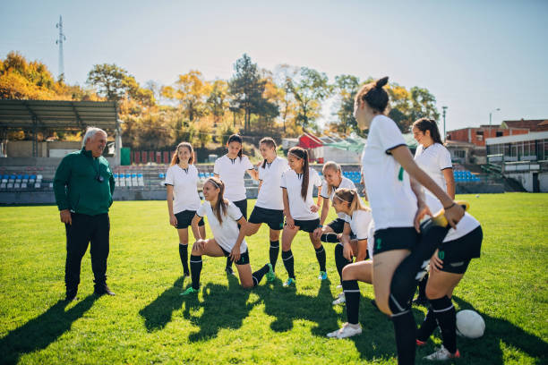 istock Women soccer team with coach 1185405792