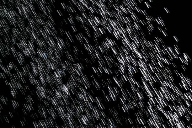Photo of Heavy Rain on black Background as Texture ,Rain on a black background ,Photos Drops of water,Drop, Water, Raindrop, Spray, Rain,Drops of water