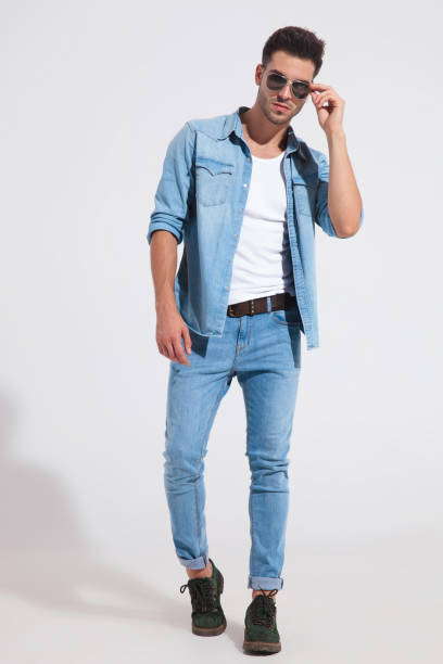 istock Confident casual man taking off his sunglasses 1185407302