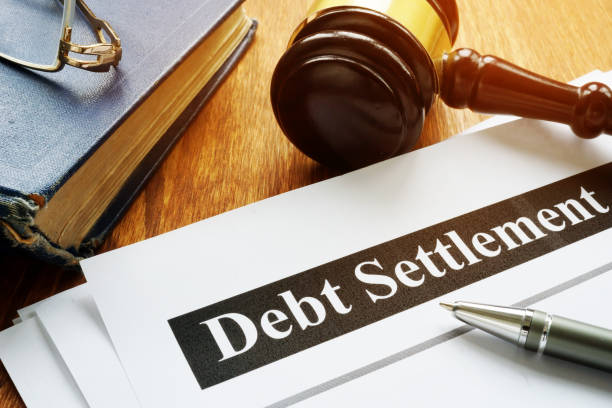 istock Debt Settlement documents and gavel in the court. 1185407345