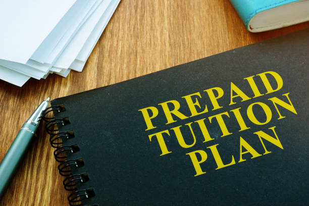 istock Prepaid Tuition Plan and papers with pan. Loan for education concept. 1185407367