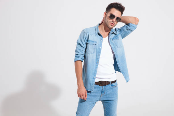 istock Charming fashion man holding his hand behind his head 1185407375