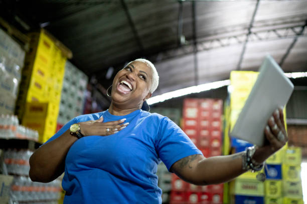 istock Surprised mature employee using digital tablet at warehouse 1185407381
