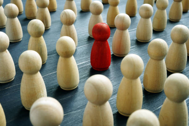 istock Unique concept. One different red figure in the crowd. 1185407385