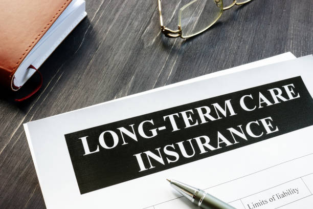 istock Long-Term Care Insurance agreement policy and notebook. 1185407394