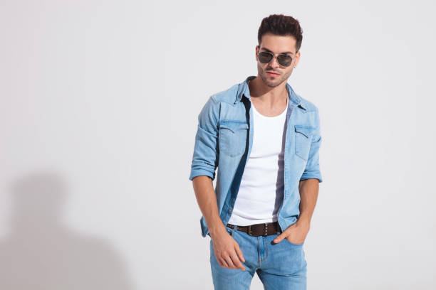 istock Tough casual man holding his hand in his pocket 1185407430