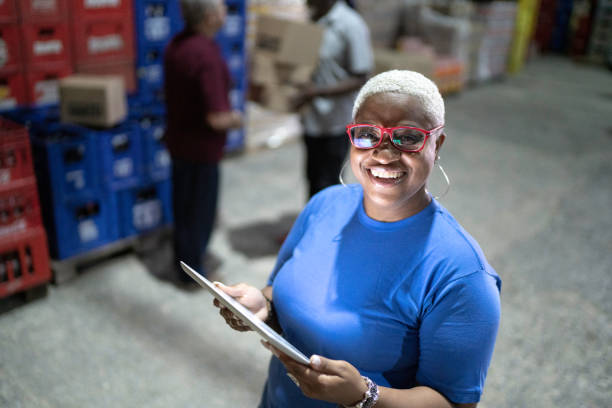 istock Portrait of mature employee using digital tablet at warehouse 1185408857