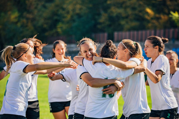 istock Women soccer team celebrating victory 1185408886