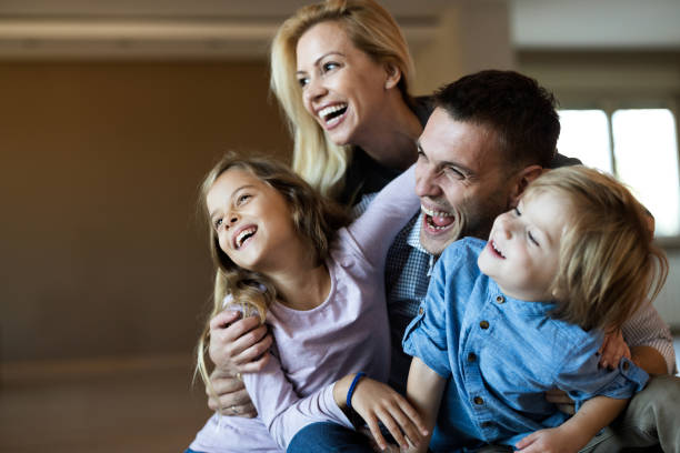 istock Young happy family having fun at their home. 1185409646