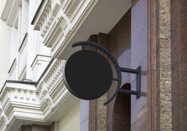 istock Blank black outdoor round box mockup on marble wall 1185409978
