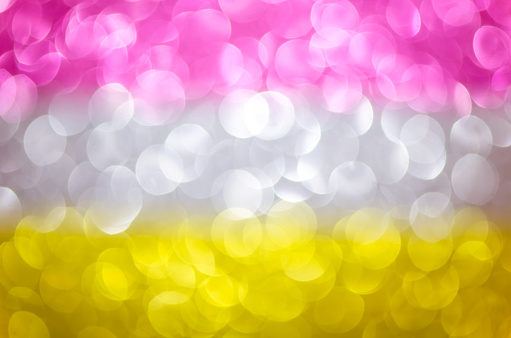Abstract glitter three color lights background. de-focused. pink, silver, yellow