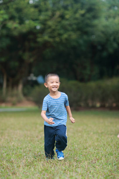 istock Cute children playing in the park 1185413336