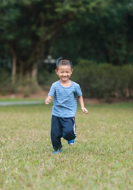 istock Cute children playing in the park 1185413345