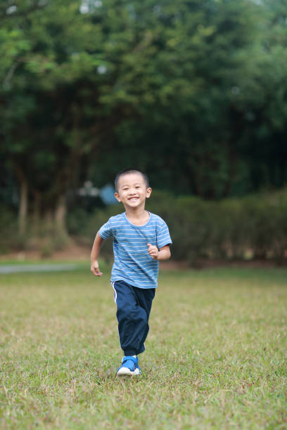 istock Cute children playing in the park 1185413352