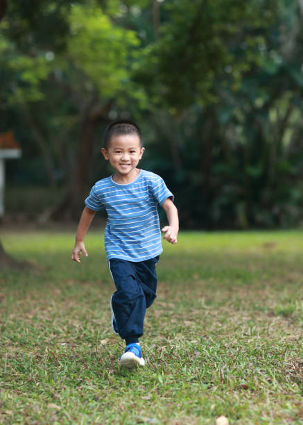 istock Cute children playing in the park 1185413389