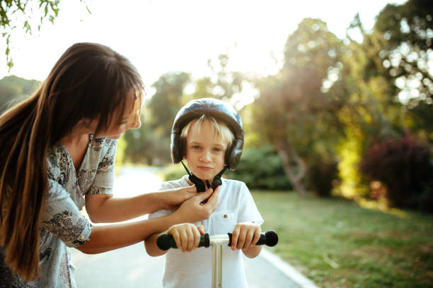 istock Cute little boy playing outside with his mom. 1185413424