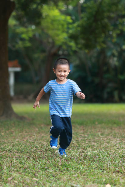 istock Cute children playing in the park 1185413439