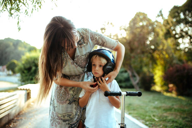 istock Cute little boy playing outside with his mom. 1185414302