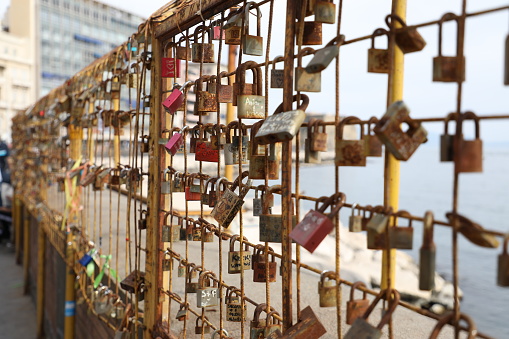 A love lock or love padlock is a padlock that sweethearts lock to a bridge, fence, gate, monument, or similar public fixture to symbolize their love.