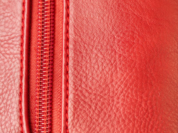 istock Red leather background with red zipper, copy space 1185416515