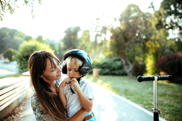 istock Cute little boy playing outside with his mom. 1185417214