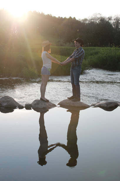 istock Cute couple on a walk by the countryside 1185417302