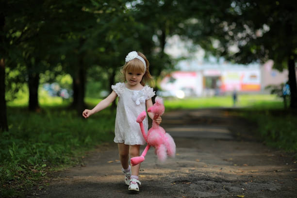 istock Mom with two daughters twins 1185418551