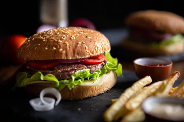 istock classic burger with fries, close-up shot 1185421236