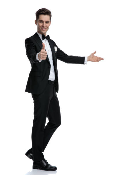 istock confident young man making thumbs up sign and inviting 1185421424