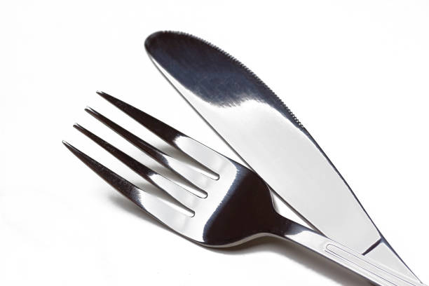 istock Fork and knife close-up isolated, cutlery, flatware. 1185424439