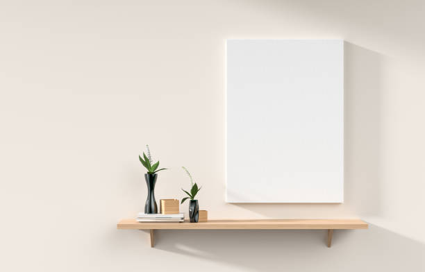 istock Mock up poster frame on white wall with wooden rack. 3D illustration 1185424771