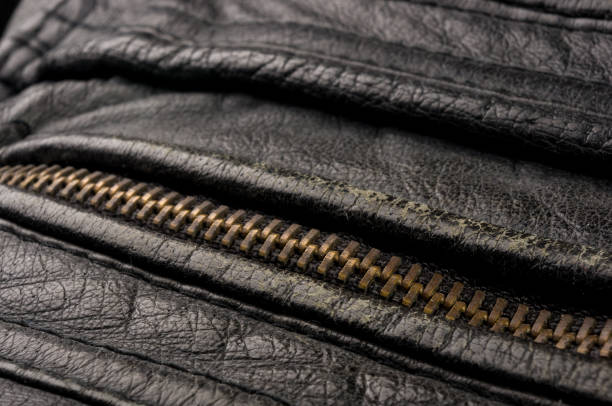 istock Old vintage genuine soft black leather texture background, top layer with pores and scratches, macro, close-up 1185425749