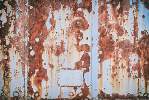 High Res Photograph of a rusty blue painted steel plate.