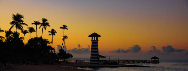 istock caribbean sea sunrise lighthouse 1185426485