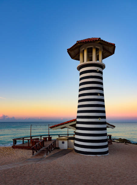 istock caribbean sea sunrise lighthouse 1185427109