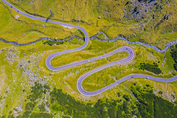 istock Summer alpine mountain road from above 1185427501